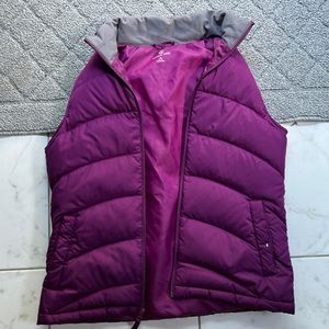 Purple puffy vest.